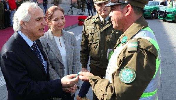 Interior Minister of Chile, Andres Chadwick (l) with Carabineros