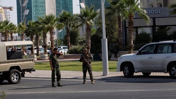 Kurdish security members stand guard near a restaurant where Turkish diplomats and Turkish consulate employee were killed in Erbil, Iraq July 17, 2019. 