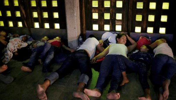 Central American migrants sleep outside the Our Lady of Guadalupe Cathedral in Ciudad Juarez, Mexico, July 14, 2019.
