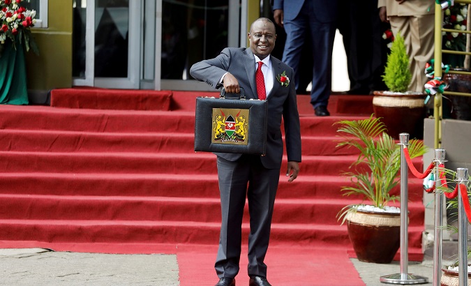 Kenya's Cabinet Secretary of National Treasury (Finance Minister) Henry Rotich holds up a briefcase containing the Government Budget for the 2019/20 fiscal year in Nairobi, Kenya, June 13, 2019.