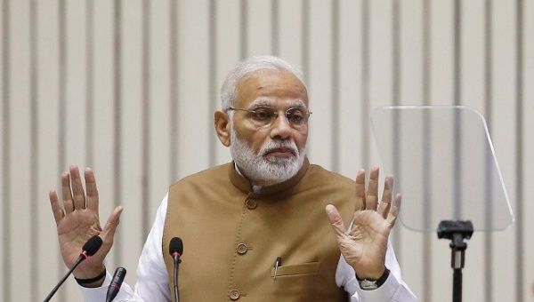 Modi gestures as he addresses the gathering during the 'Global Mobility Summit' in New Delhi, India, September 7, 2018.