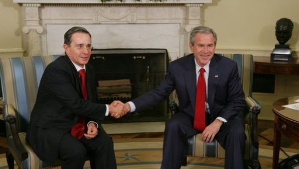 Left, Alvaro Uribe who is behind this law, a close ally of George Bush during his presidency. 