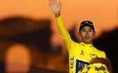 Team INEOS rider Egan Bernal of Colombia celebrates on the podium, after winning the general classification and the overall leader