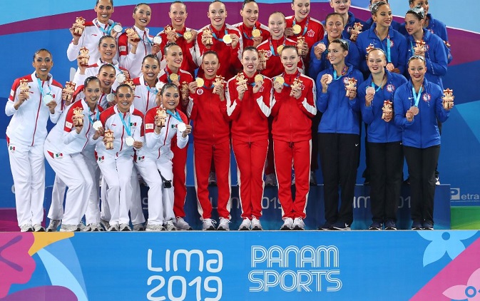 Team Canada (C),Team Mexico (L) and Team USA stand on the podium after winning the gold, silver and bronze medals respectively in the Artistic Swimming during the XVIII Pan American Games on July 31, 2019.