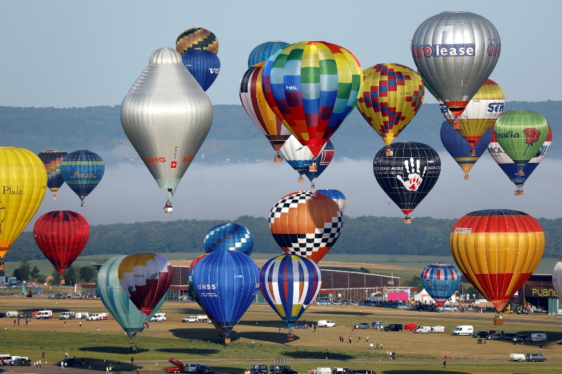 Organizers said the colorful, biennial event was the biggest international event in the world with a record of 456 balloons filing into order during festival.