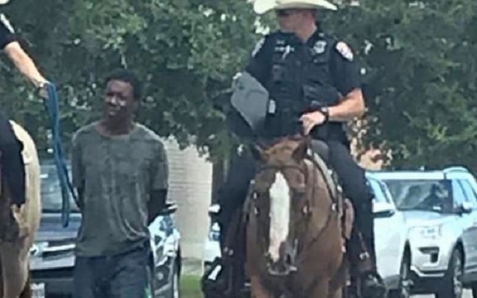 Donald Neely being led down a Galveston street by officers Bosch and Smith during his arrest for alleged trespassing.  Aug 5, 2019
