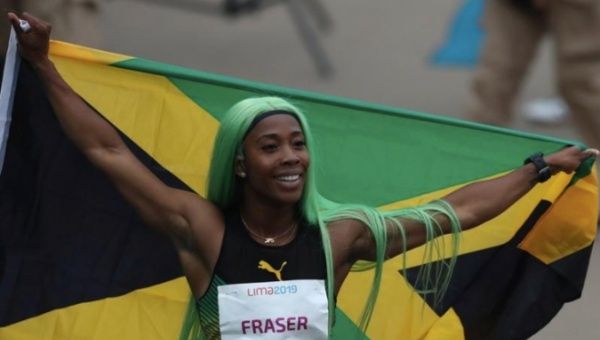  Jamaica's Shelly-Ann Fraser-Pryce celebrates after winning the gold medal in the event.