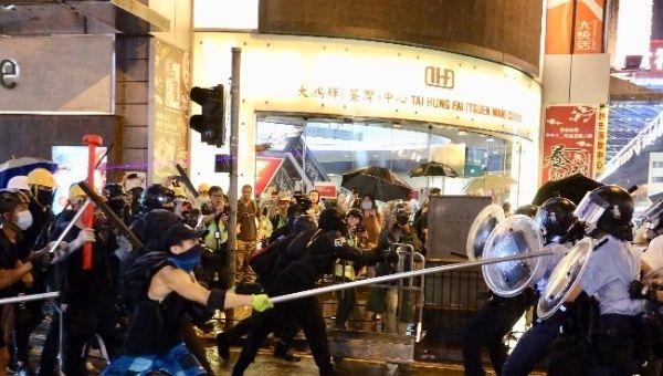 Radical protesters attack police officers in Tsuen Wan, in the western New Territories of south China's Hong Kong, Aug. 25, 2019.