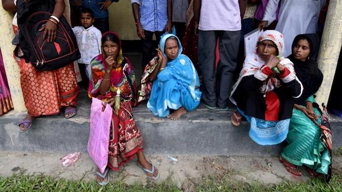 Villagers outside the NRC center in Morigaon district to get their documents verified by officials