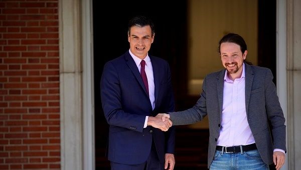  Spain's acting Prime Minister Pedro Sanchez greets Unidas Podemos' (Together We Can) leader Pablo Iglesias at the Moncloa Palace in Madrid, Spain
