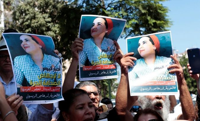 Moroccan activists hold the poster of Hajar Raissouni, a journalist charged with fornication and abortion, during a protest outside the Rabat tribunal, Morocco September 9, 2019.