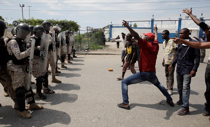 unarmed protesters face militarized police in Port au Prince, Haiti as fuel shortages are rampant across the country. Sept.11, 2019