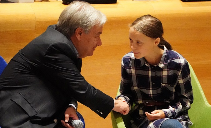 Secretary-General of the United Nations Antonio Guterres shakes hands with Swedish environmental activist Greta Thunberg at the Youth Climate Summit at United Nations Headquarters in the Manhattan borough of New York, New York, U.S., September 21, 2019.