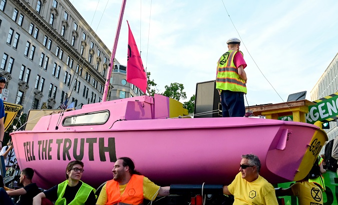 Protesters chain themselves to a boat near the White House in Washington, U.S. Sep. 23, 2019.