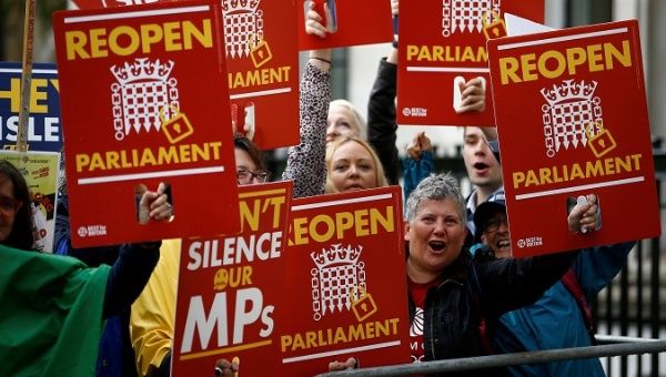 Demonstrators react to the ruling by the Supreme Court during a protest in London, Britain Sep. 24, 2019.