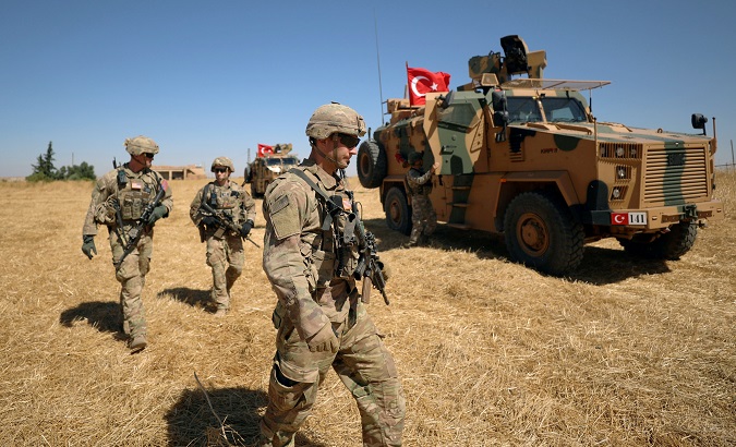 U.S. soldiers walk together during a joint U.S.-Turkey patrol, near Tel Abyad, Syria September 8, 2019.