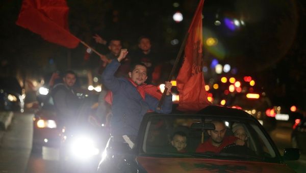 Supporters of the Self-Determination movement (Vetevendosje party) wave flags after preliminary results of the parliamentary election in Pristina, Kosovo, October 7, 2019. 