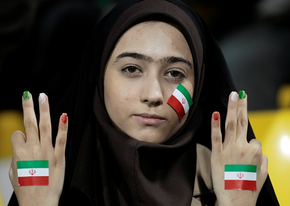 Iran allows women to attend football matches in stadiums after FIFA's pressure.