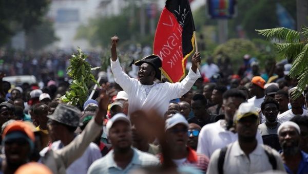 Protesters march during a demonstration to demand the resignation of Haitian president Jovenel Moise, in the streets of Port-au-Prince, Haiti October 4, 2019.