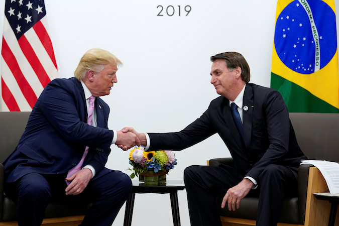 Brazil's President Jair Bolsonaro and U.S. President Donald Trump shake hands during a bilateral meeting at the G20 leaders summit in Osaka, Japan, June 28, 2019.