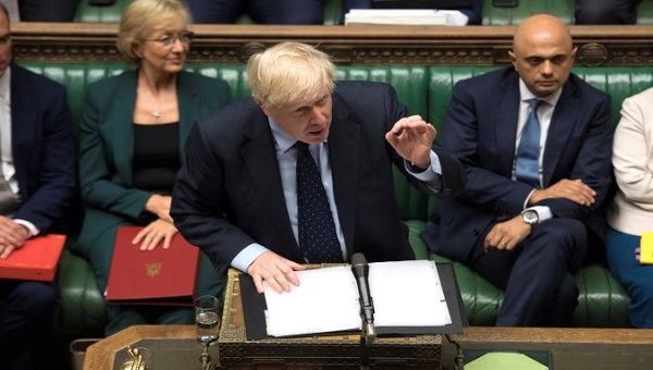 U.K. Prime Minister Boris Johnson was ambushed in Parliament on Saturday by his rivals trying to block an Oct. 31 Brexit.