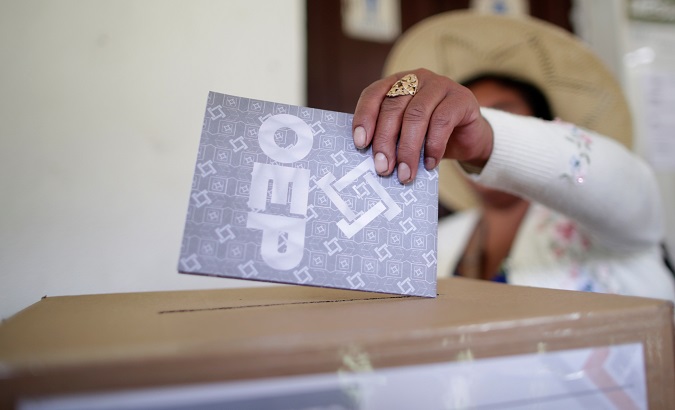 A woman casts her vote at a polling station during the presidential election in Paracti in the Chapare region, Cochabamba, Bolivia, Oct. 20, 2019.