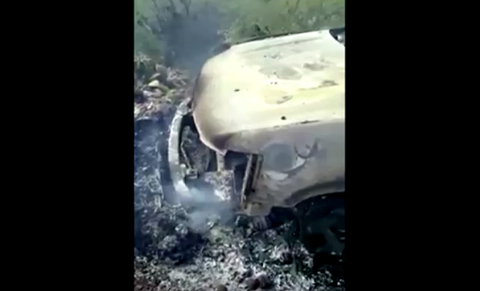 Burnt out vehicle that may belong to family killed in Mexico attack.