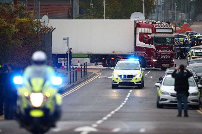 Police move the lorry container where bodies were discovered, in Grays, Essex, Britain October 23, 2019.