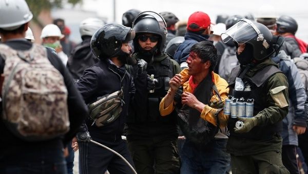 Police detain a man who was protesting against the coup d'etat in La Paz, Bolivia Nov. 11, 2019.