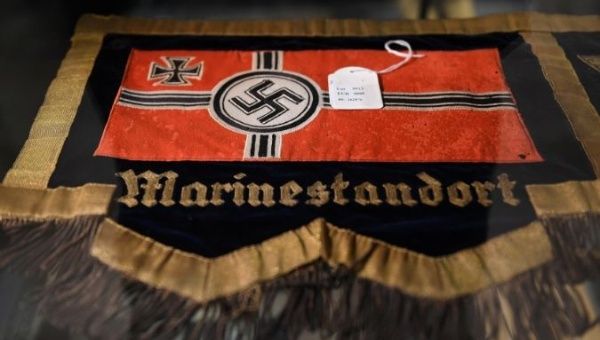 A flag with a swastika is seen in a cupboard at the auction house Hermann Historica in Munich, Germany, November 20, 2019.