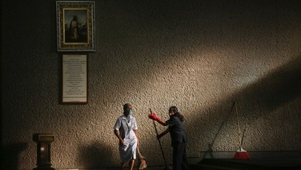 Women clean inside the Basilica de Guadalupe in Mexico City on 3rd May, 2009 .