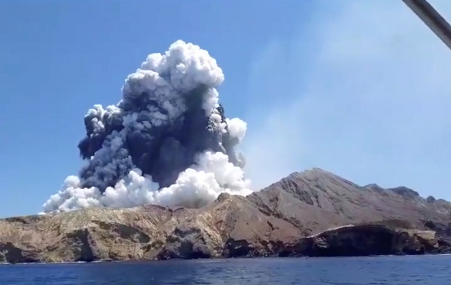 Smoke from the volcanic eruption of Whakaari, also known as White Island, is pictured from a boat, New Zealand December 9, 2019 in this picture grab obtained from a social media video.