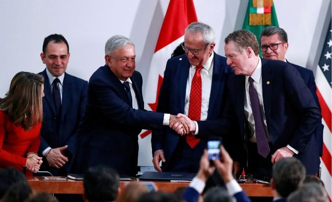 Mexican Deputy Foreign Minister for North America Jesus Seade looks on as Mexico's President Andres Manuel Lopez Obrador shakes hands with U.S. Trade Representative Robert Lighthizer during a meeting at the Presidential Palace, in Mexico City, Mexico December 10, 2019.