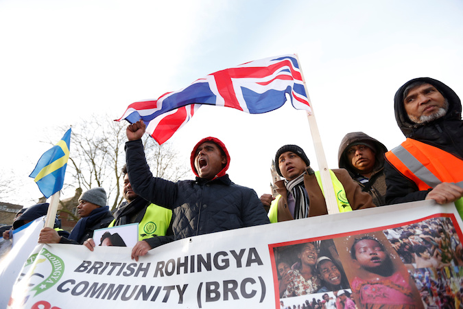 People protest outside the International Court of Justice (ICJ) during a hearing in a case filed by Gambia against Myanmar alleging genocide against the minority Muslim Rohingya population, in The Hague, Netherlands December 10, 2019.