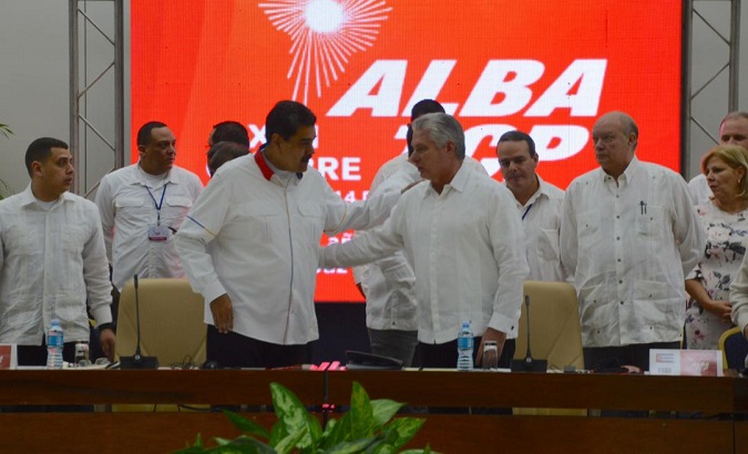 Venezuela’s President Nicolas Maduro (L) and Cuba’s President Miguel Diaz-Canel (R) greet at the beginning of the 17th ALBA-TCP Summit in Havana, Cuba, Dec. 14, 2019.