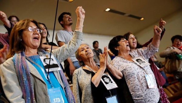 Demonstrators opposing the government shout slogans after the lawmakers rejected a move to impeach President Sebastian Pinera during a session at the congress in Valparaiso, Chile December 12, 2019.