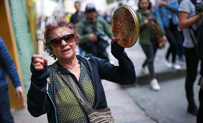 Woman takes part in a protest as a national strike continues in Bogota, Colombia Dec. 16, 2019.