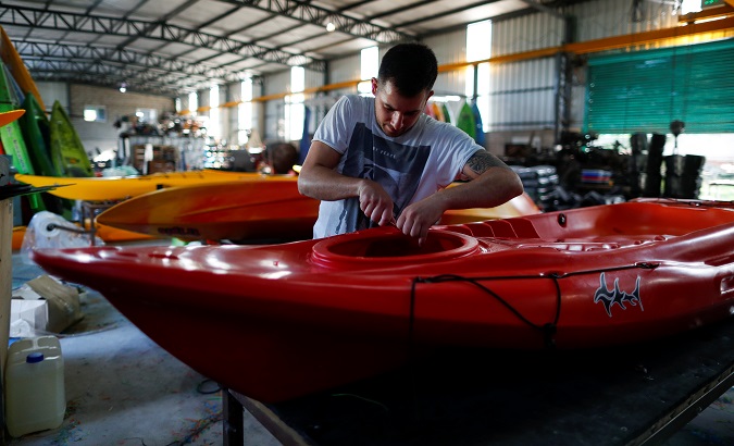 An employee works at the kayak factory in Buenos Aires, Argentina, Dec. 17, 2019.