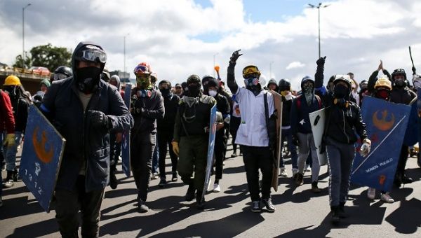 Demonstrators take part in a protest as a national strike continues in Bogota, Colombia December 19, 2019. 