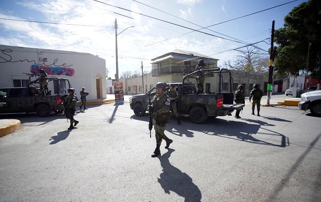 Members of the Mexican National Guard patrol near to the bullet-riddled building of the town hall of Villa Union days after a gun battle between police and hitmen, in the municipality of Villa Union, state of Coahuila, Mexico December 2, 2019.