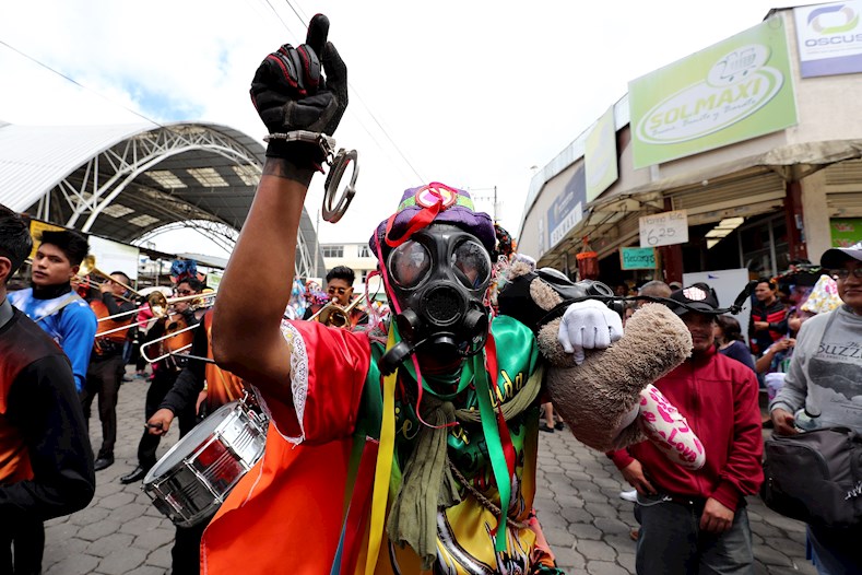 Devil dancers worn the new symbols of the people's protest, Pillaro, Ecuador, January 3, 2020.
