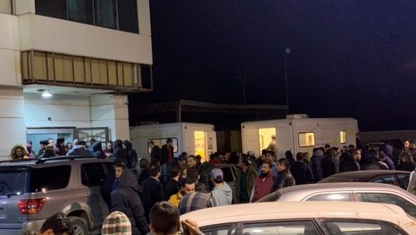 People wait near medical facilities to donate blood after an attack on a military academy in Tripoli, Libya January 5, 2020 in this image obtained from social media. 