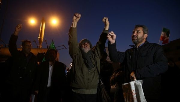 People gesture as they celebrate in the street after Iran launched missiles at U.S.-led forces in Iraq, in Tehran, Iran, January 8, 2020