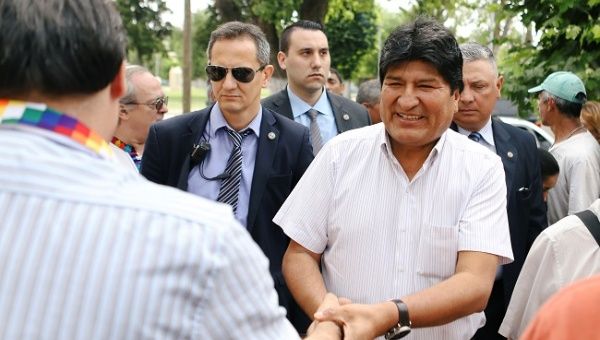 Bolivian President Evo Morales greets while arriving to visit a group of Argentinian priests called 
