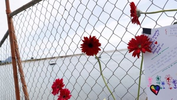 Flowers are seen at a memorial at the harbour in Whakatane, following the White Island volcano eruption in New Zealand, December 11, 2019.