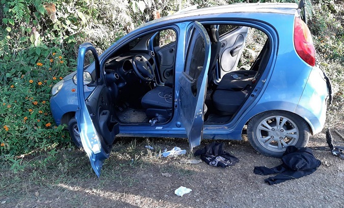 One of three vehicles attacked by armed men in the Jamundi municipality, Colombia, Jan. 16, 2020.