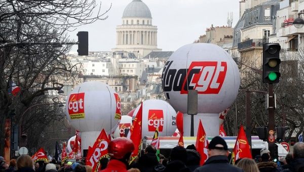 Citizens attend a demonstration against Macron's pensions reform plans in Paris, France, Jan. 29, 2020. 