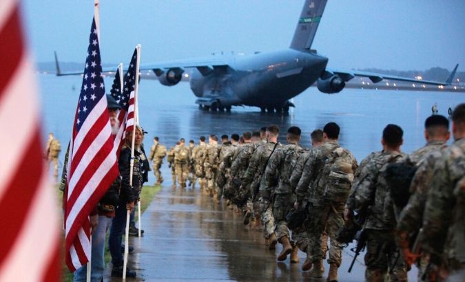 U.S Army paratroopers prepare to board an aircraft bound for the U.S. Central Command area of operations from Fort Bragg, North Carolina, U.S. Jan. 4, 2020.