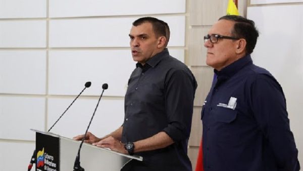 Venezuela's Minister of Transport, Hipólito Abreu (left), gives a statement to the media on Monday in Caracas, Venezuela