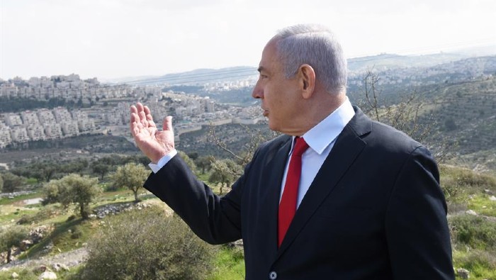 Israeli Prime Minister Benjamin Netanyahu overlooks construction of new settlements in the occupied West Bank.